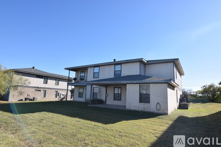 A house with a lawn in front of it is for sale.