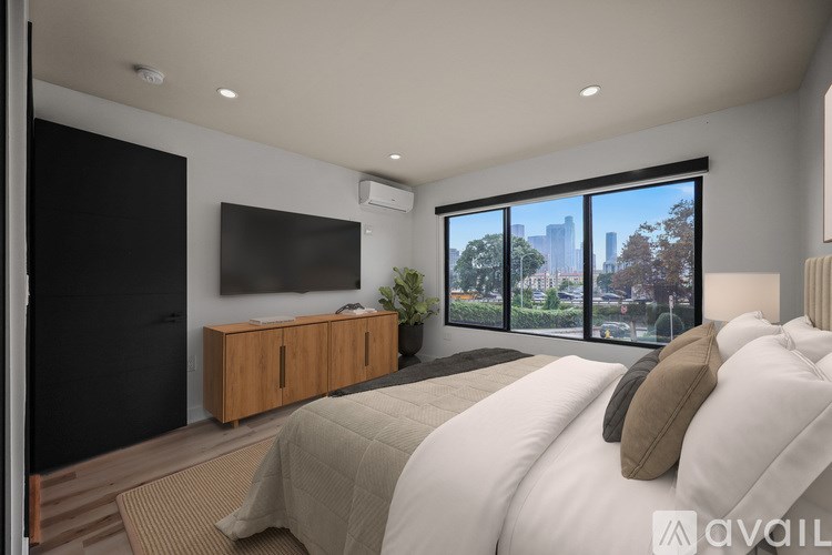A modern two-story house with a white and brown exterior.