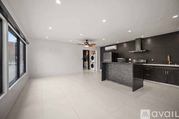 A modern bedroom with a large bed and a flat screen TV.
