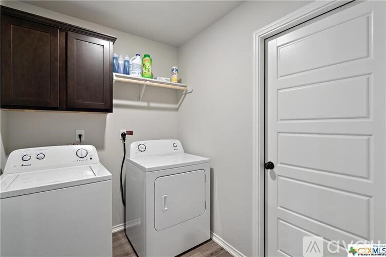A laundry room with a washer and dryer.