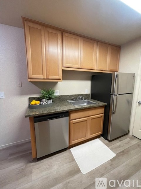 A bathroom with a toilet, sink, and shower.