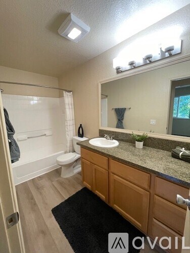 A graphic with a wheelchair and a house symbolizing equal housing opportunity.