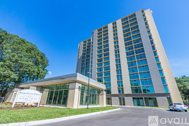 A tall building with a sign that reads "Annual Cystis Disease" in front of it.