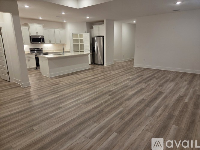A kitchen with a refrigerator and a countertop.