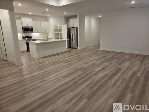 A kitchen with a refrigerator and a countertop.