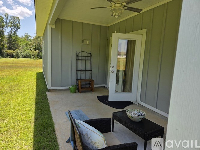 A patio area with a table and chairs.