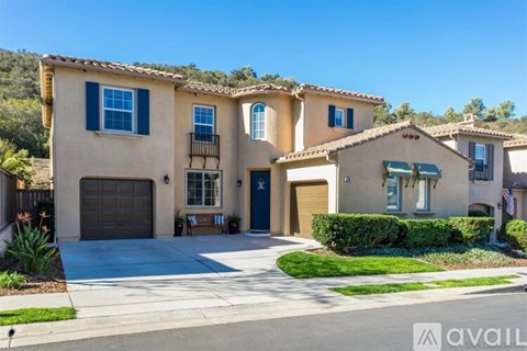 A large house with a driveway in front of it.