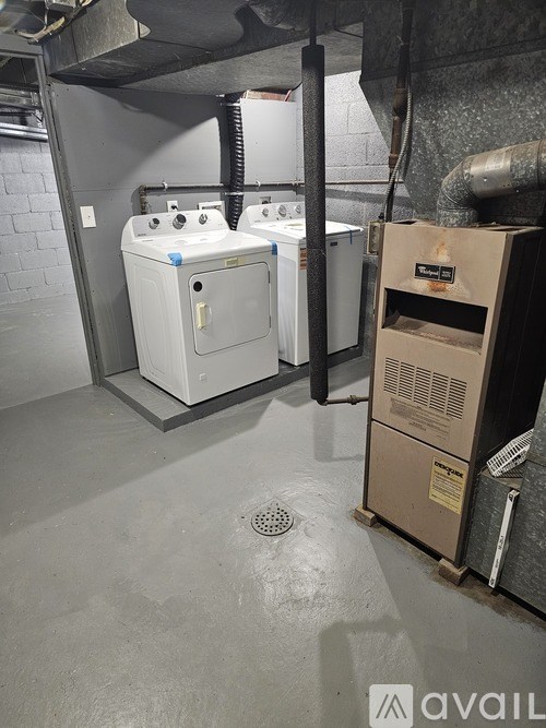 A small bathroom with a washer and dryer.
