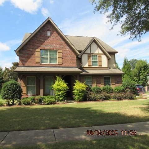 A house with a brown brick exterior and a grey roof.