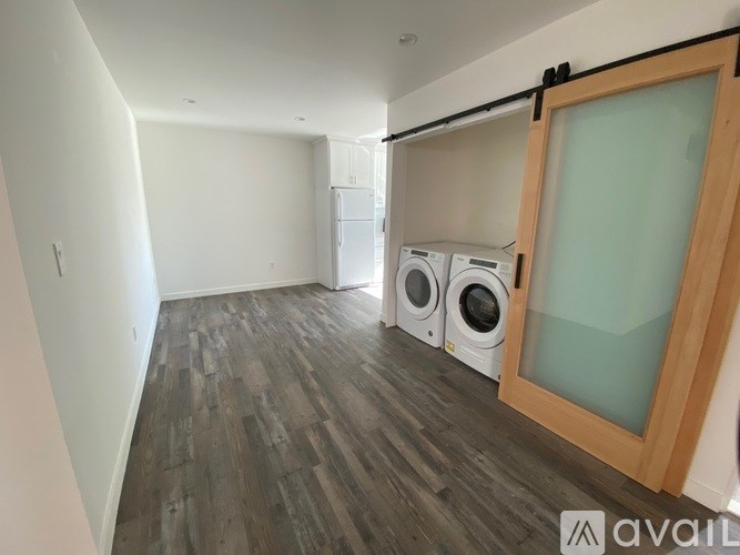 A laundry room with a washer and dryer.