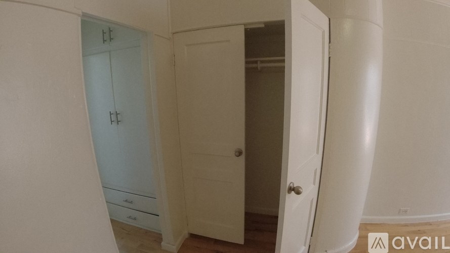 A white door with a handle is in the room.