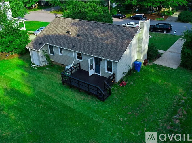A house with a garage and a carport is for sale.