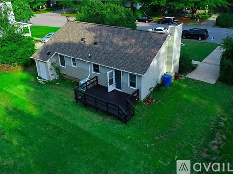 A house with a garage and a carport is for sale.