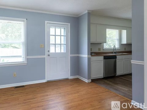 A kitchen with a sink and cabinets.