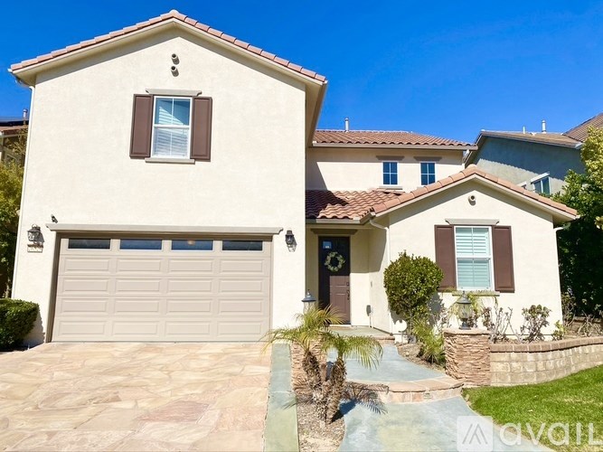 A house with a garage and a driveway.