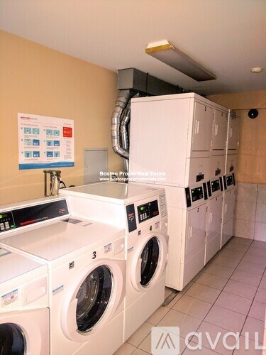 A row of washing machines in a laundromat.