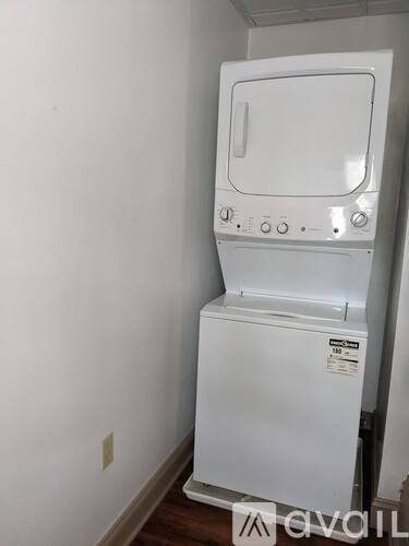 A white washing machine in a room.