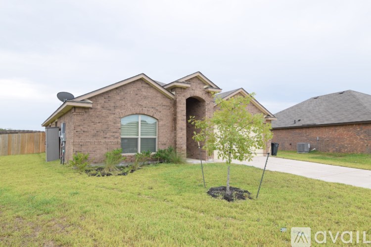A house with a tree in front of it.