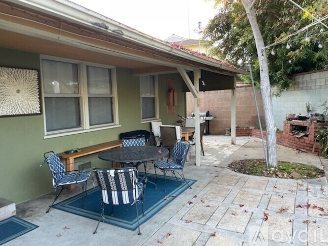 A patio with a table and chairs is shown.