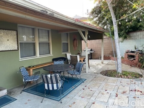 A patio with a table and chairs is shown.