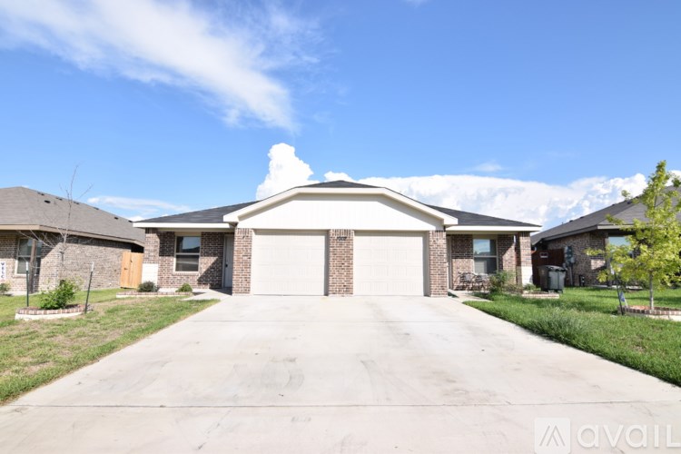 A house with a driveway in front of it.