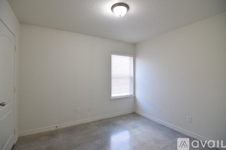 A room with a window and a door.