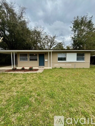 A small building with a sign that says "Gate, Estates, Rentals" in front of it.