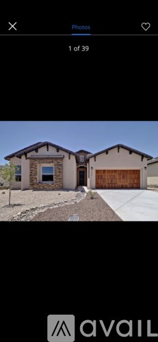 A house with a brown garage door is shown.