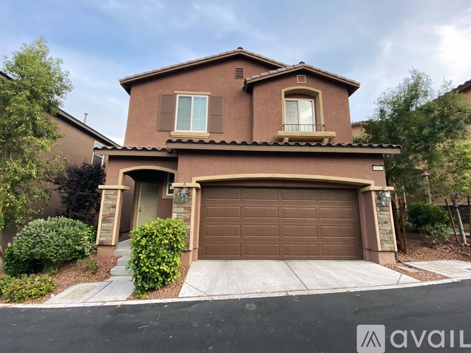 A house with a brown garage door is for sale.