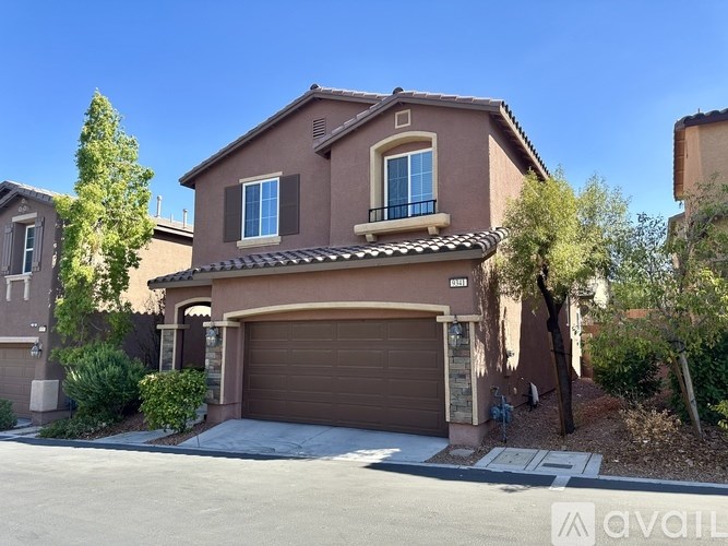 A house with a brown garage door is for sale.