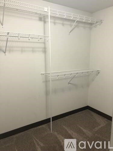 Empty shelves in a white room.