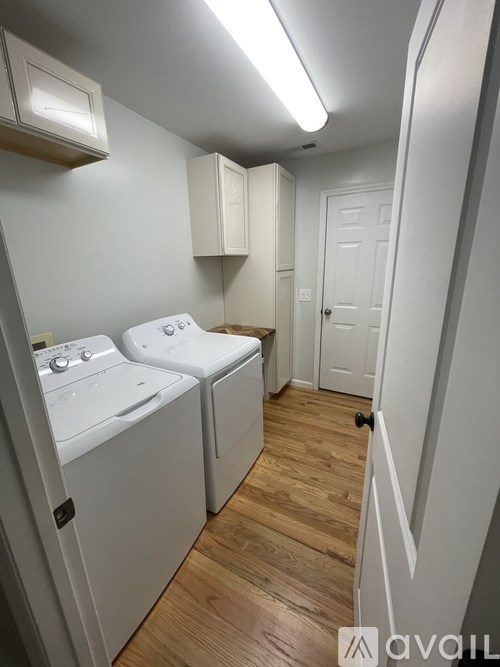 A laundry room with a washer and dryer.