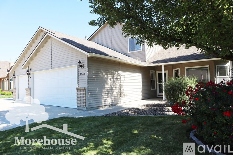 A house with a Morehouse Property Management logo.