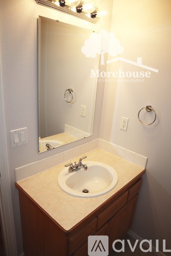 A bathroom sink with a mirror above it.