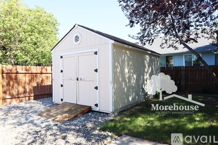 A shed with a Morehouse Property Management logo.