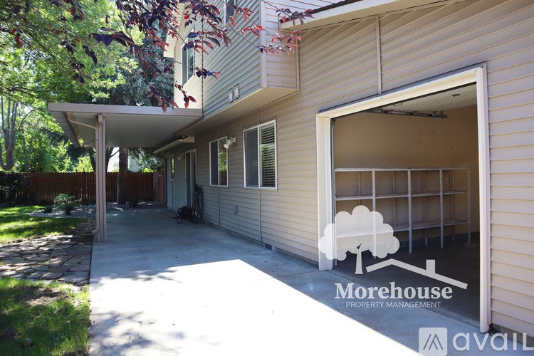 A house with a Morehouse Property Management logo on the garage door.