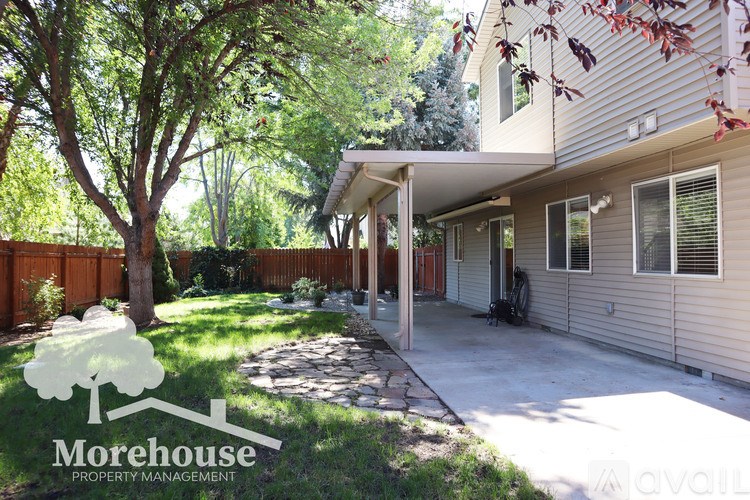 A house with a Morehouse Property Management logo in the foreground.
