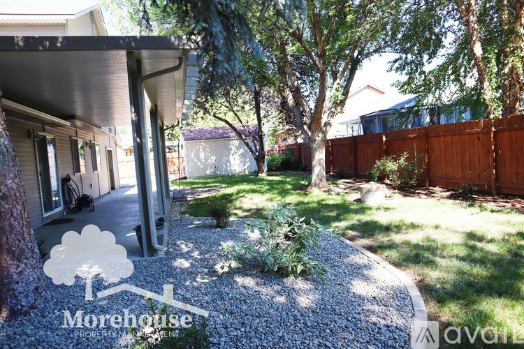 A Morehouse Property Management logo is superimposed on a photo of a home's backyard.