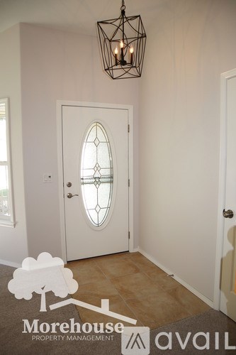 A white door with a stained glass window is the focal point of this image.