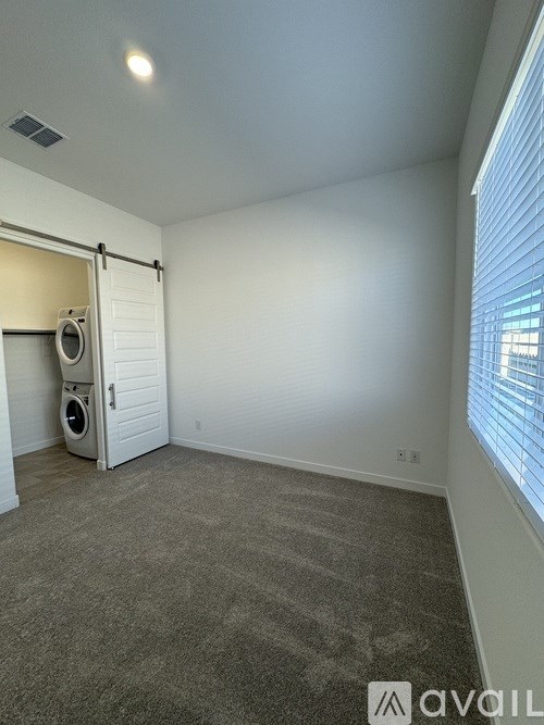 A room with a washer and dryer in it.