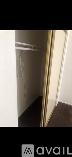 A white door with a mirror on the right side.