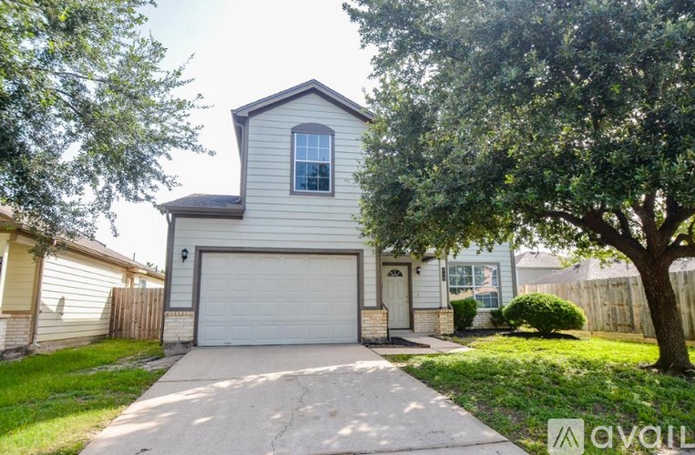 A house with a garage is for sale.