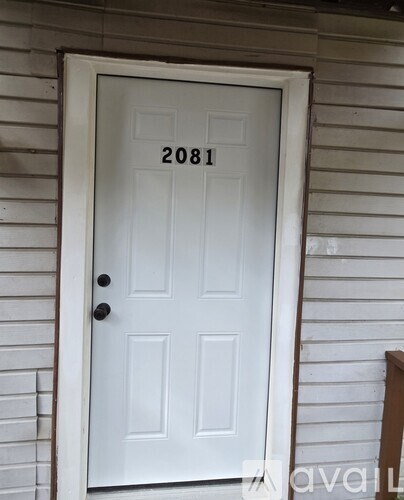 A white door with the number 2081 on it.