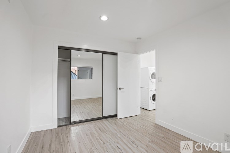A room with a washer and dryer in it.