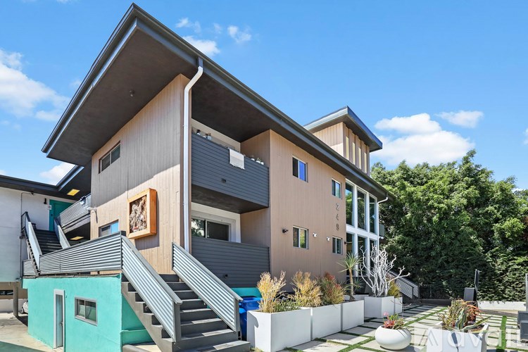 A modern house with a staircase leading to the second floor.