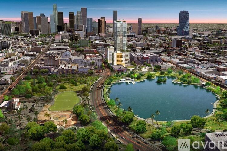 A cityscape with a large body of water and a tall building in the center.