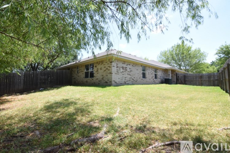 A house with a fence in front of it.
