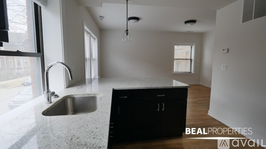 A modern kitchen with a sink and a dishwasher.