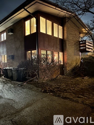 A house with a lit up sign that says "avail".