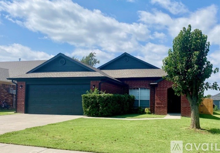 A house with a tree in front of it.